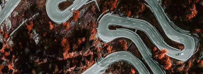 Looking down onto a twisting road from the sky.